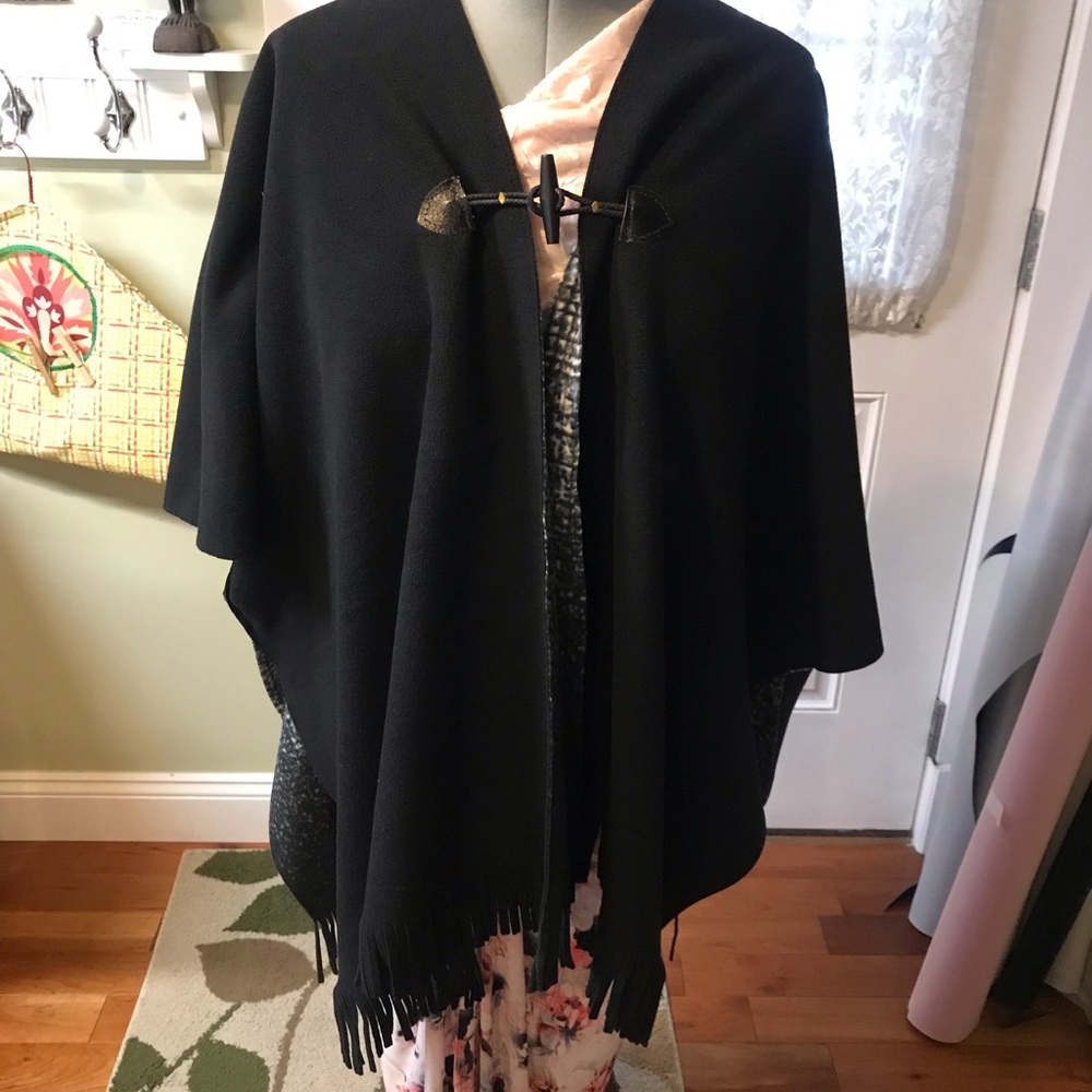 Cape. Brand new. Reversible to black hook close.